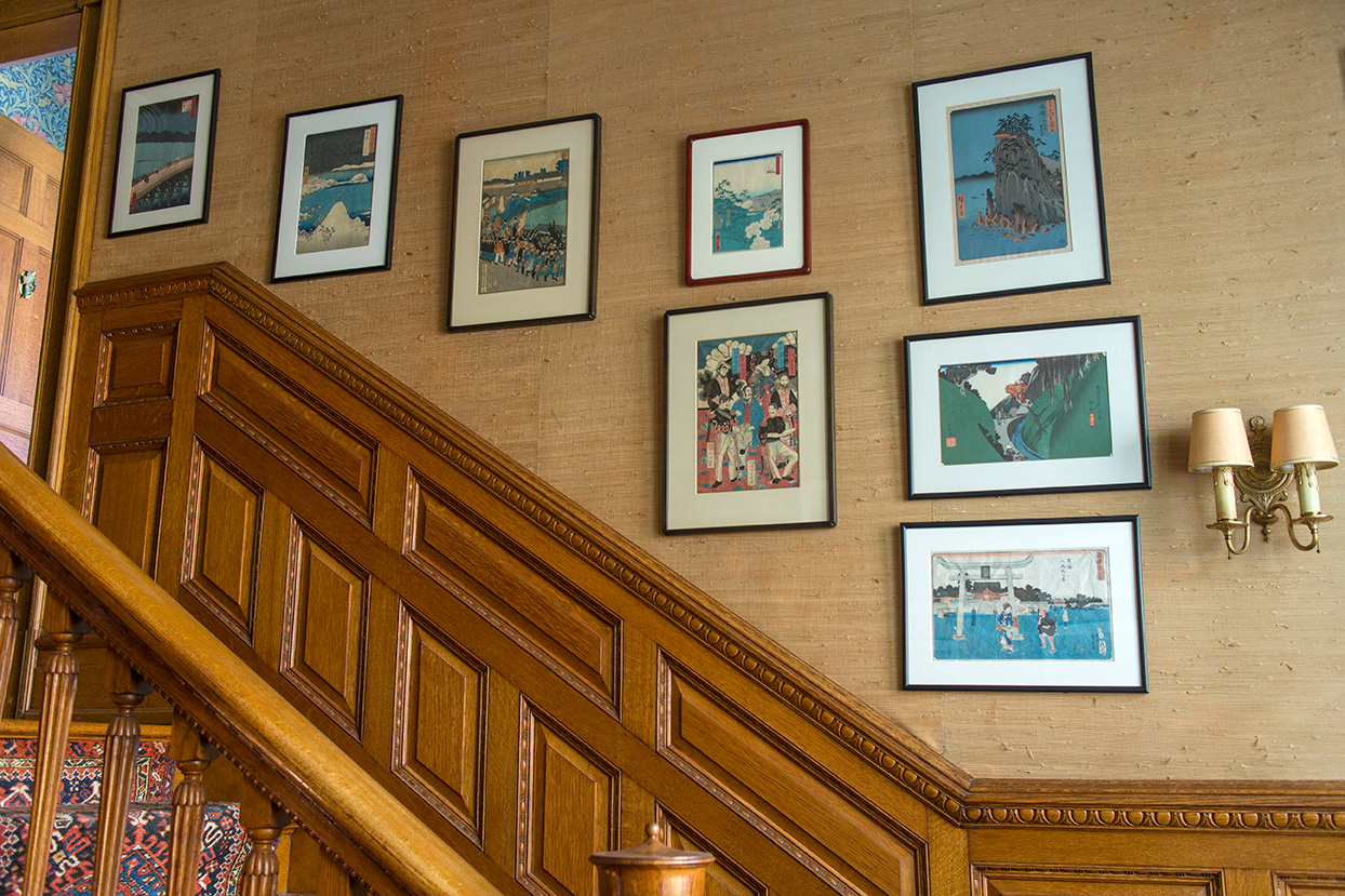 Hiroshige prints continue into the upper staircase